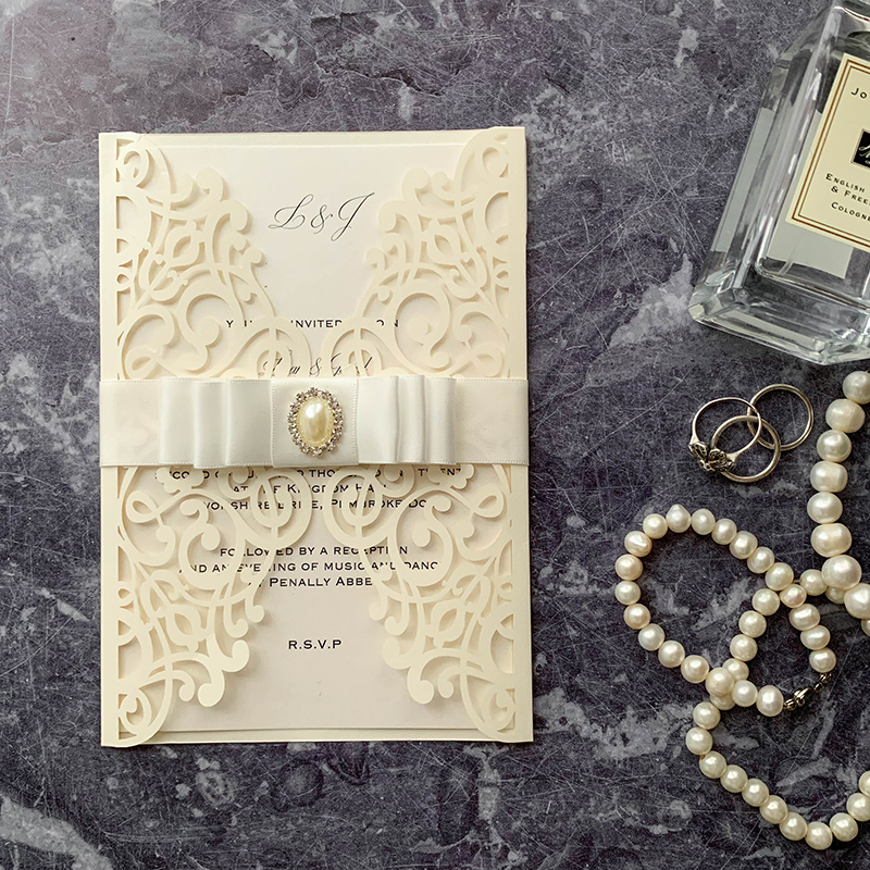 Ivory Lavish laser cut invitation with Triple dior bow and Pale and crystal oval embellishment   WowVow