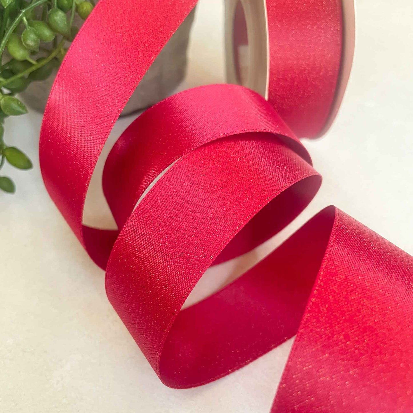 wide red ribbon with gold sparkle
