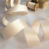1 inch wide satin ribbon in nude colour.  25mm wide