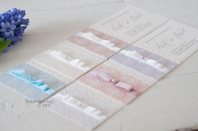 flat wedding invitations in pastel colors with dior bows    Imagine DIY