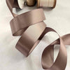 25mm wide satin ribbon in minky brown.  Sold by the meter or on a roll