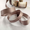 1 inch wide satin ribbon in minky brown colour.  Sold by the meter or on a roll