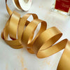 13mm satin ribbon in old gold colour.  An opulent ribbon sold by the meter or on the roll