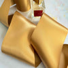 10cm wide satin ribbon in gold.  Extra wide ribbon