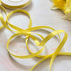 narrow satin ribbon in lemon yellow.  Sold by the roll or by the metre.  6mm wide.