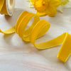 Roll if velvet ribbon in mustard yellow.  16mm wide