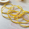 3mm wide velvet ribbon.  Narrow velvet ribbon in mustard yellow