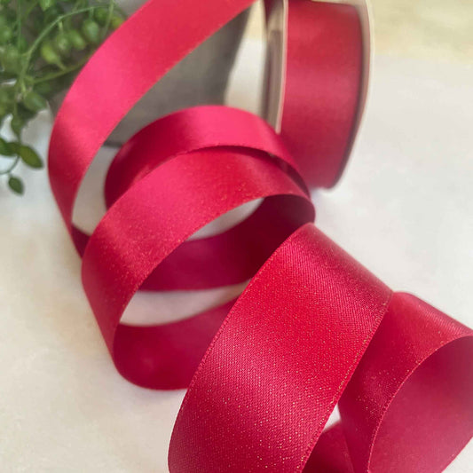 red satin ribbon with a gold sparkle