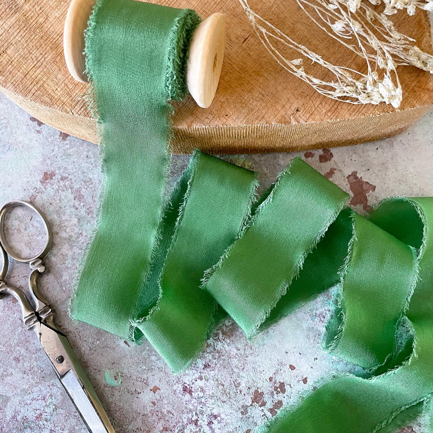 25mm-silk-ribbon-on-wooden-reel-emerald-green