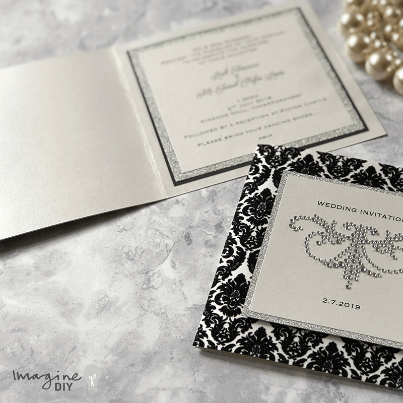 black_and_silver_diy_wedding_invitation_with_crystals_and_flock