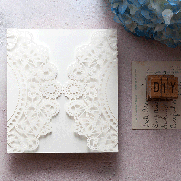 blank-laser-cut-wedding-invitaiton-in-white-doily-pattern