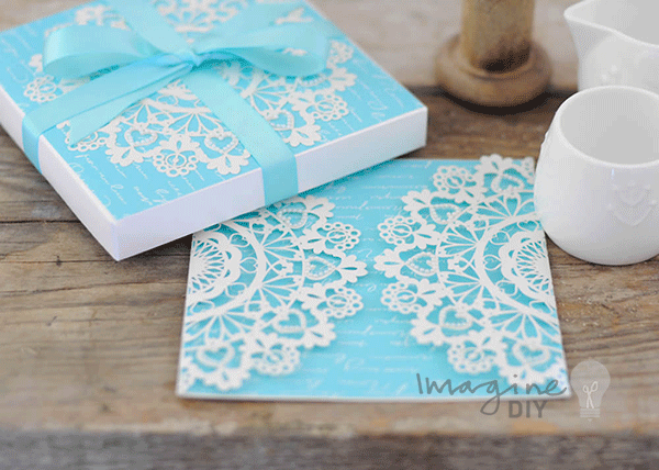 diy_laser_cut_wedding_invitation_in_turquoise_and_white_with_hearts