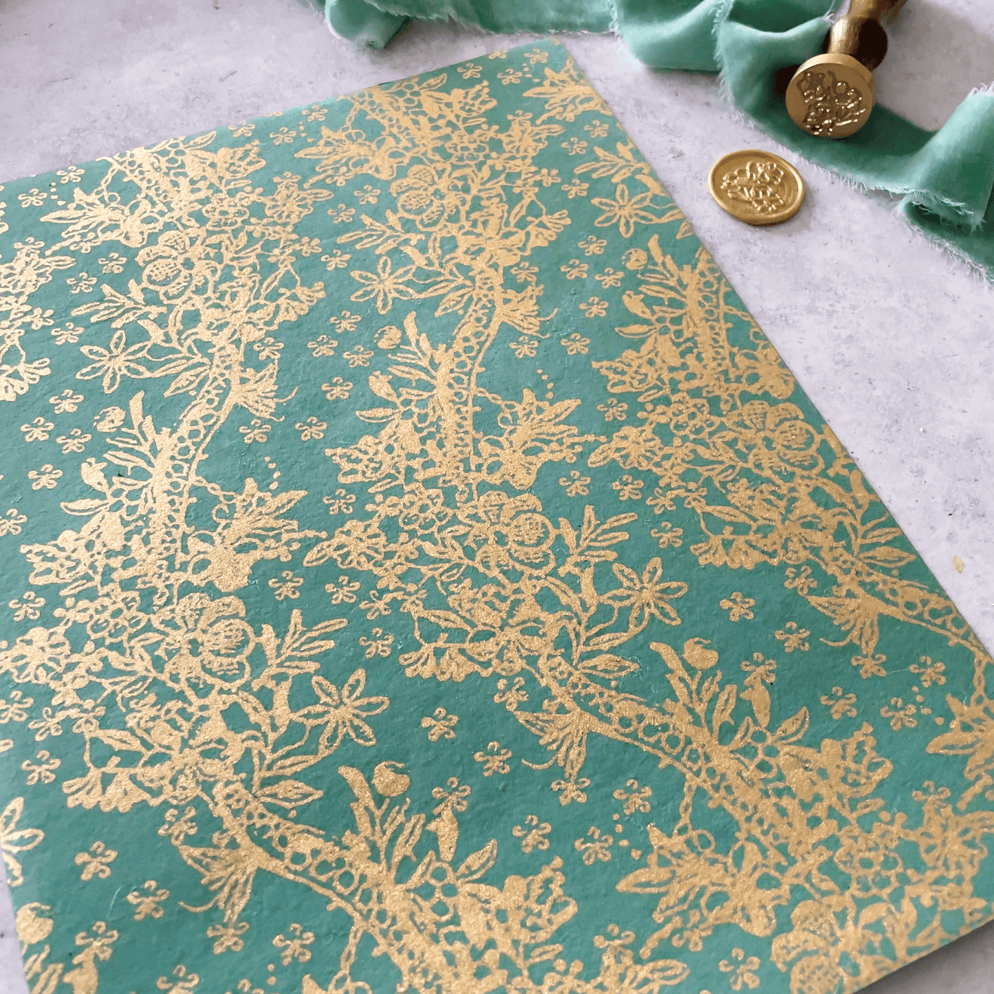 jade-green-and-gold-patterned-recycled-paper