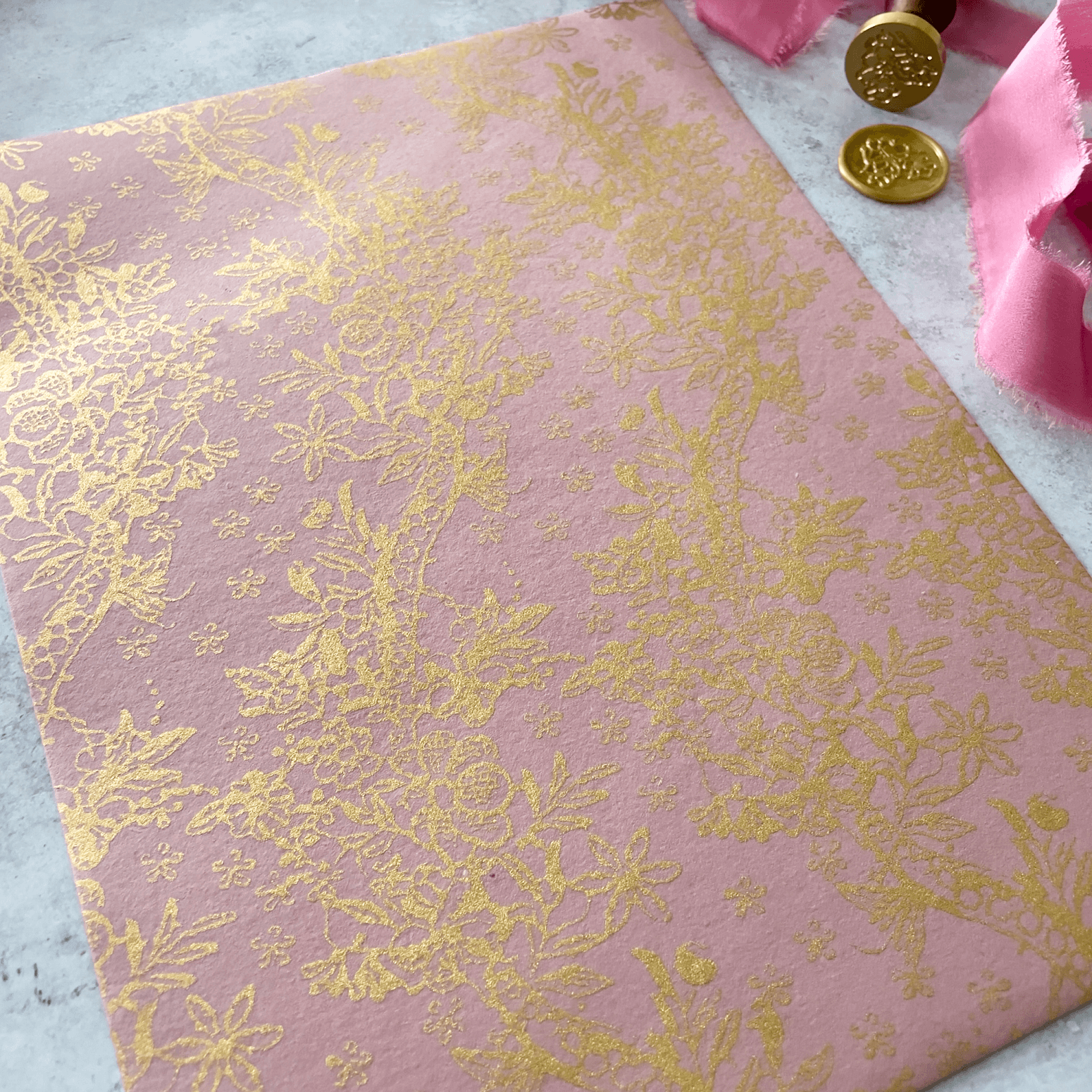 pink-recycled-paper-with-gold-pattern