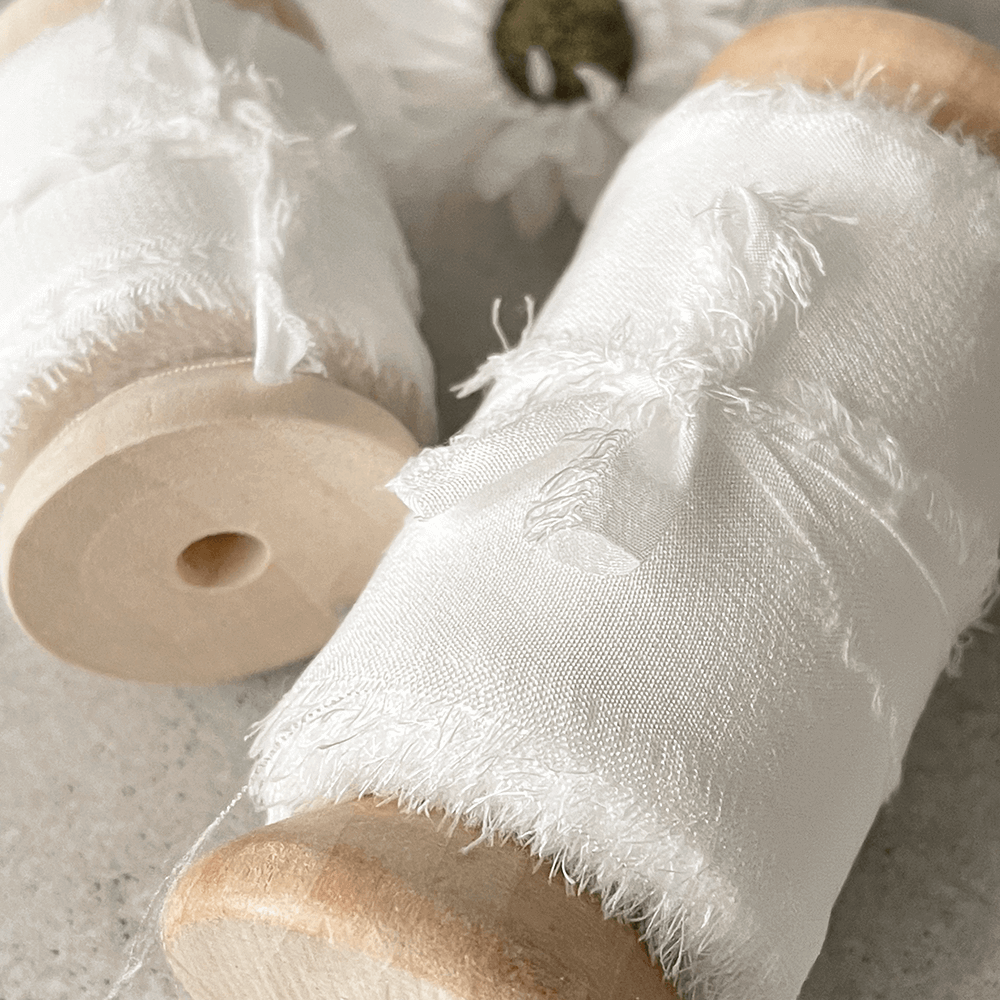white-silk-ribbon-50mm-wide-on-wooden-spool